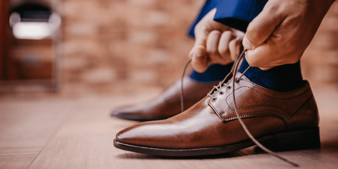 leather shoes being tied